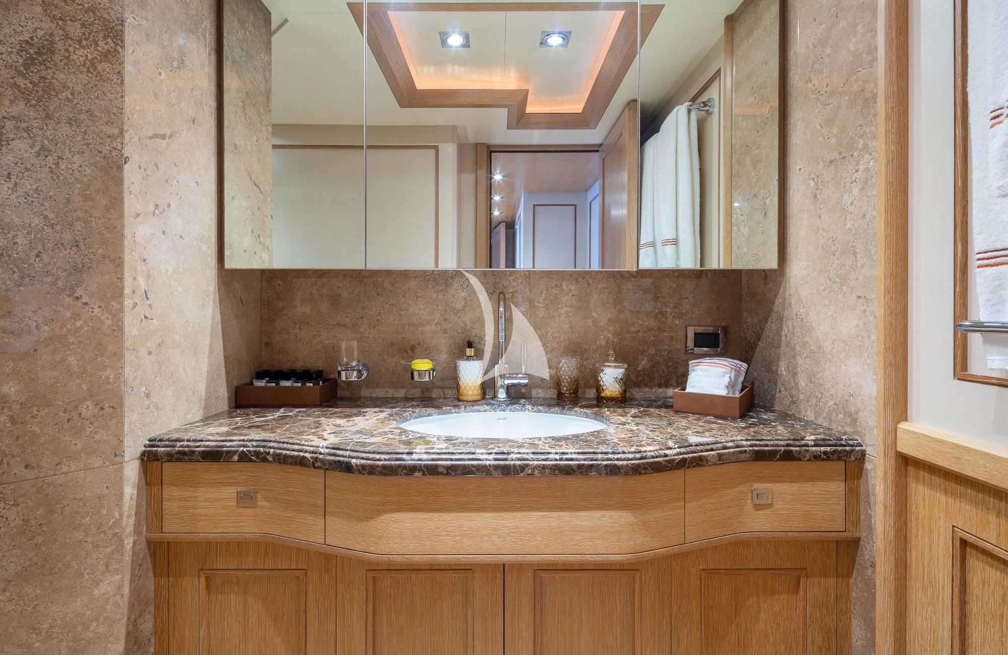 a bathroom with a sink and a mirror aboard LADY I Yacht for Charter