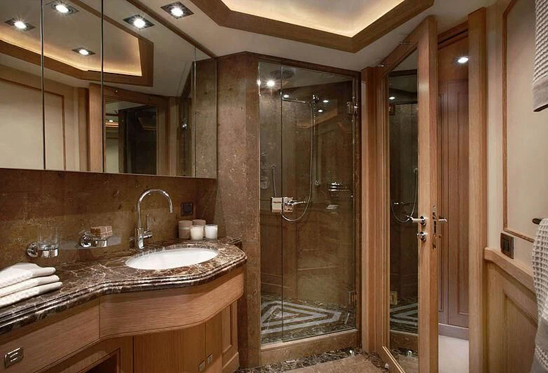 a bathroom with a large glass shower aboard LADY I Yacht for Charter