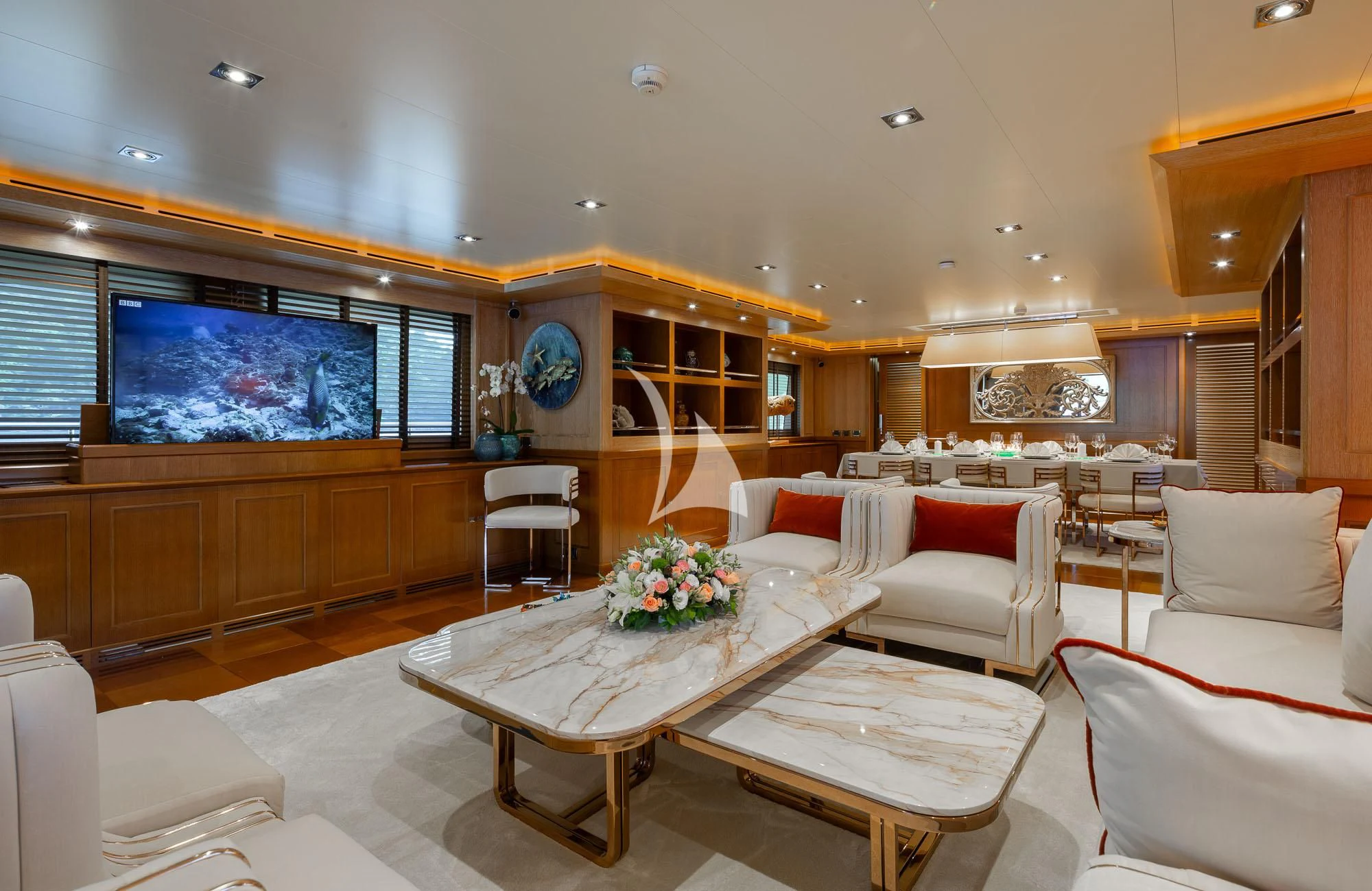 a living room with a large screen aboard LADY I Yacht for Charter