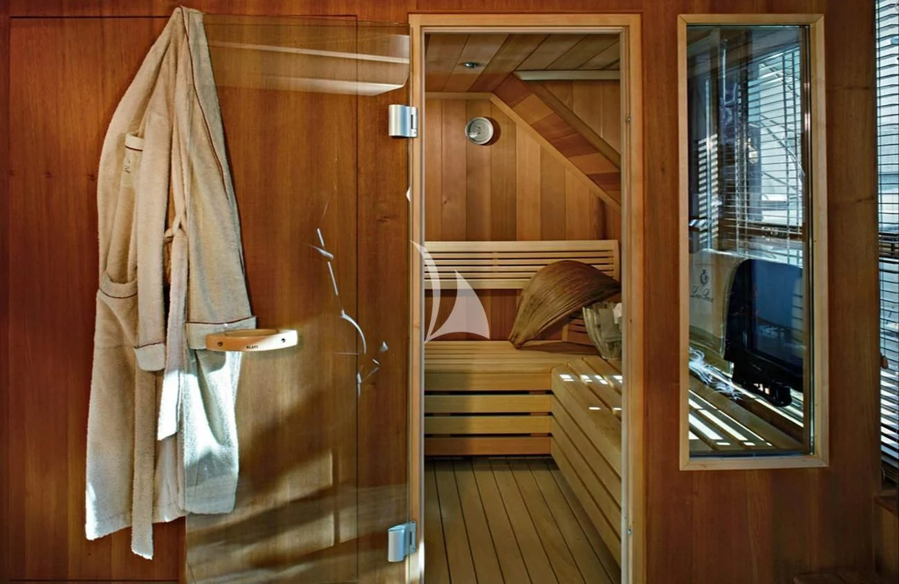 a room with a wood door and a mirror aboard LADY I Yacht for Charter