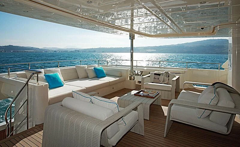a large lounge area with a large body of water in the background aboard LADY I Yacht for Charter
