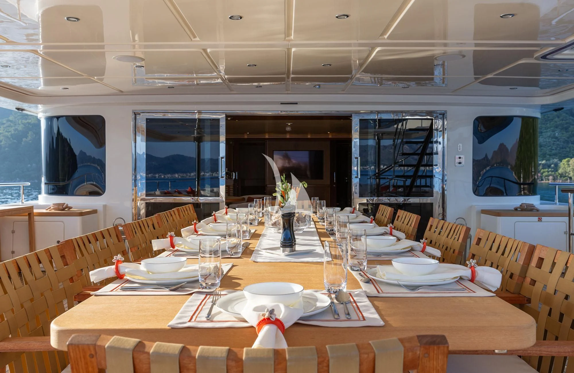 a table set for a dinner aboard LADY I Yacht for Charter
