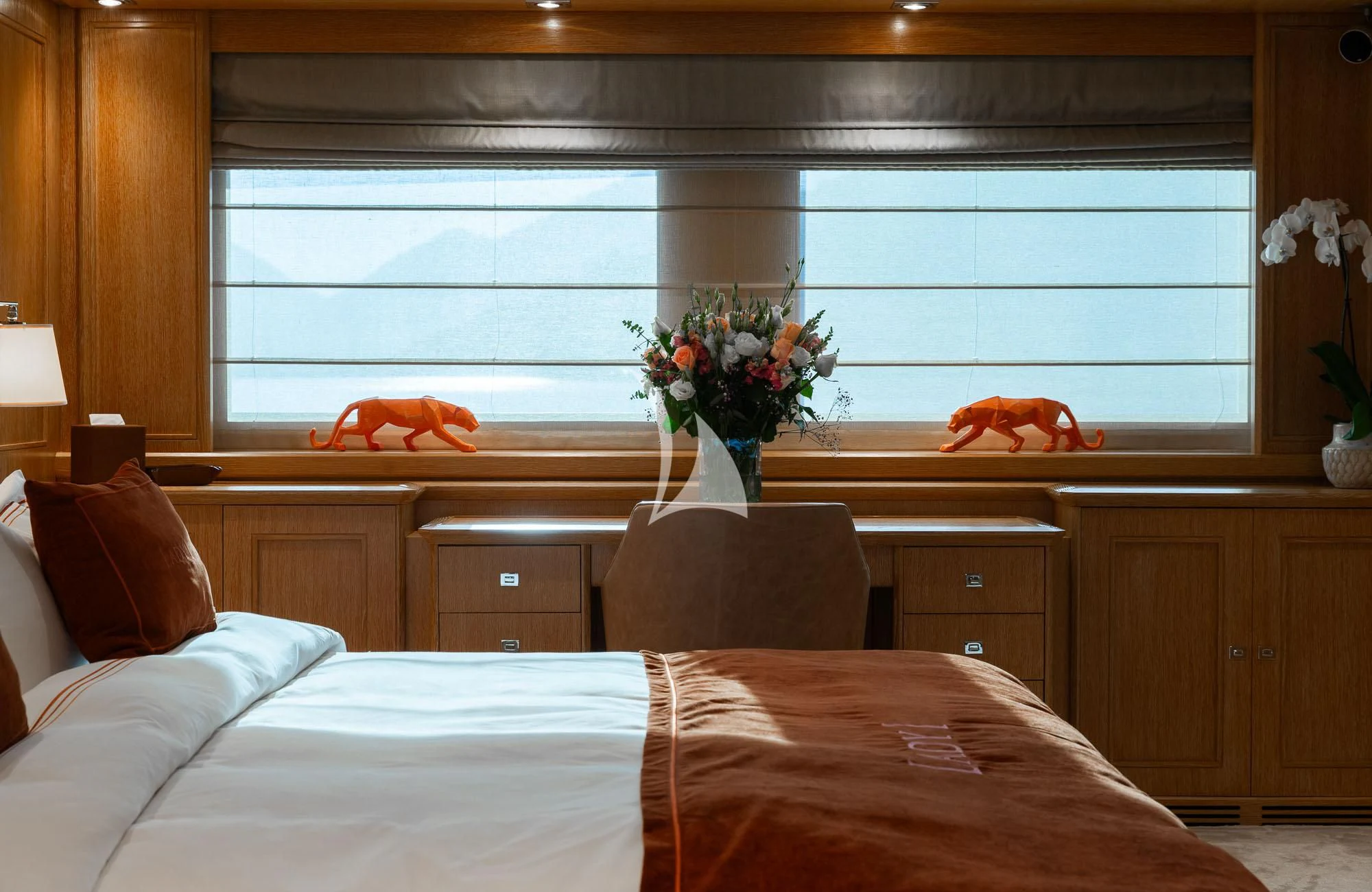 a cat on a window sill aboard LADY I Yacht for Charter