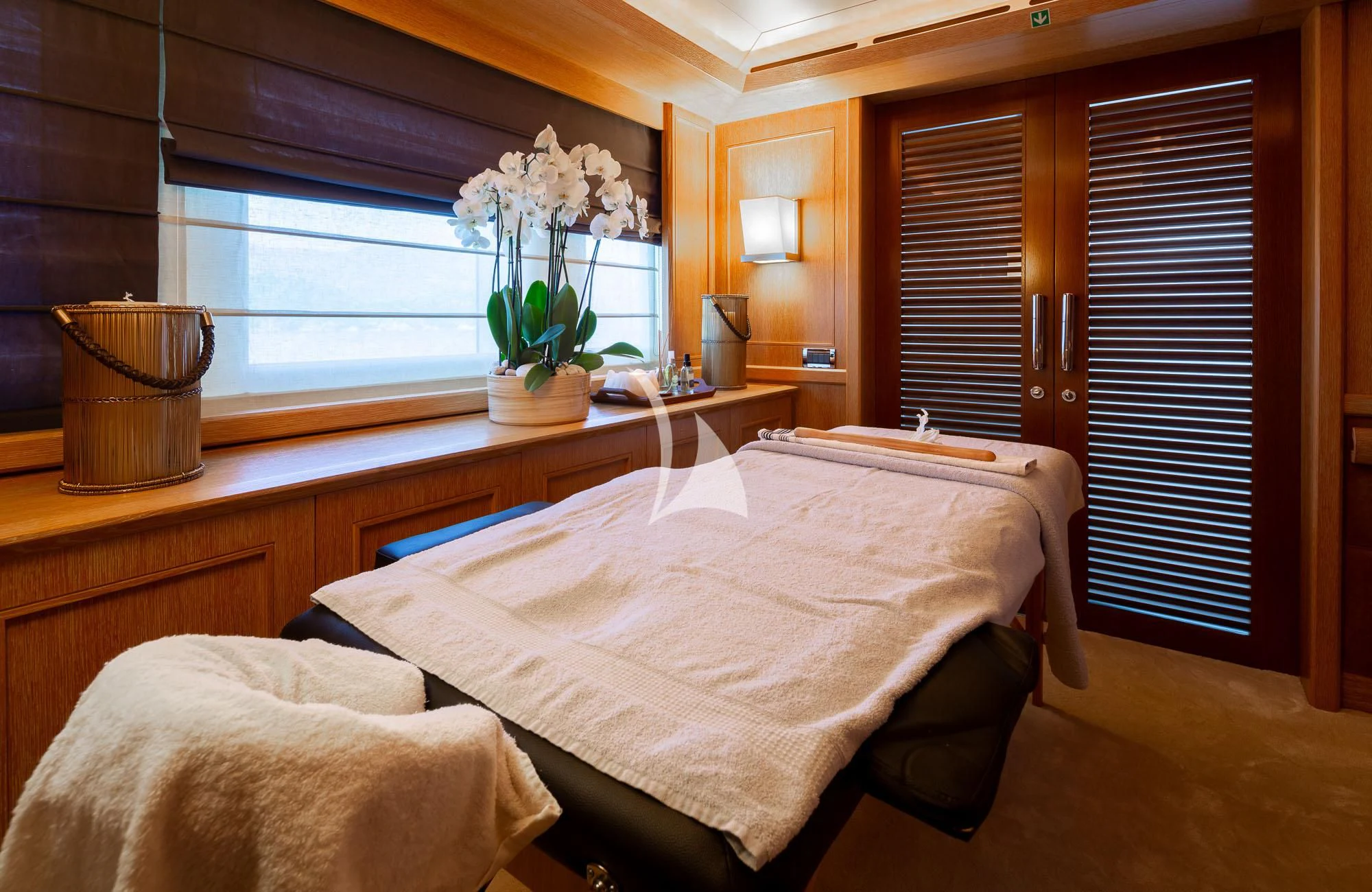 a room with a bed and a window aboard LADY I Yacht for Charter