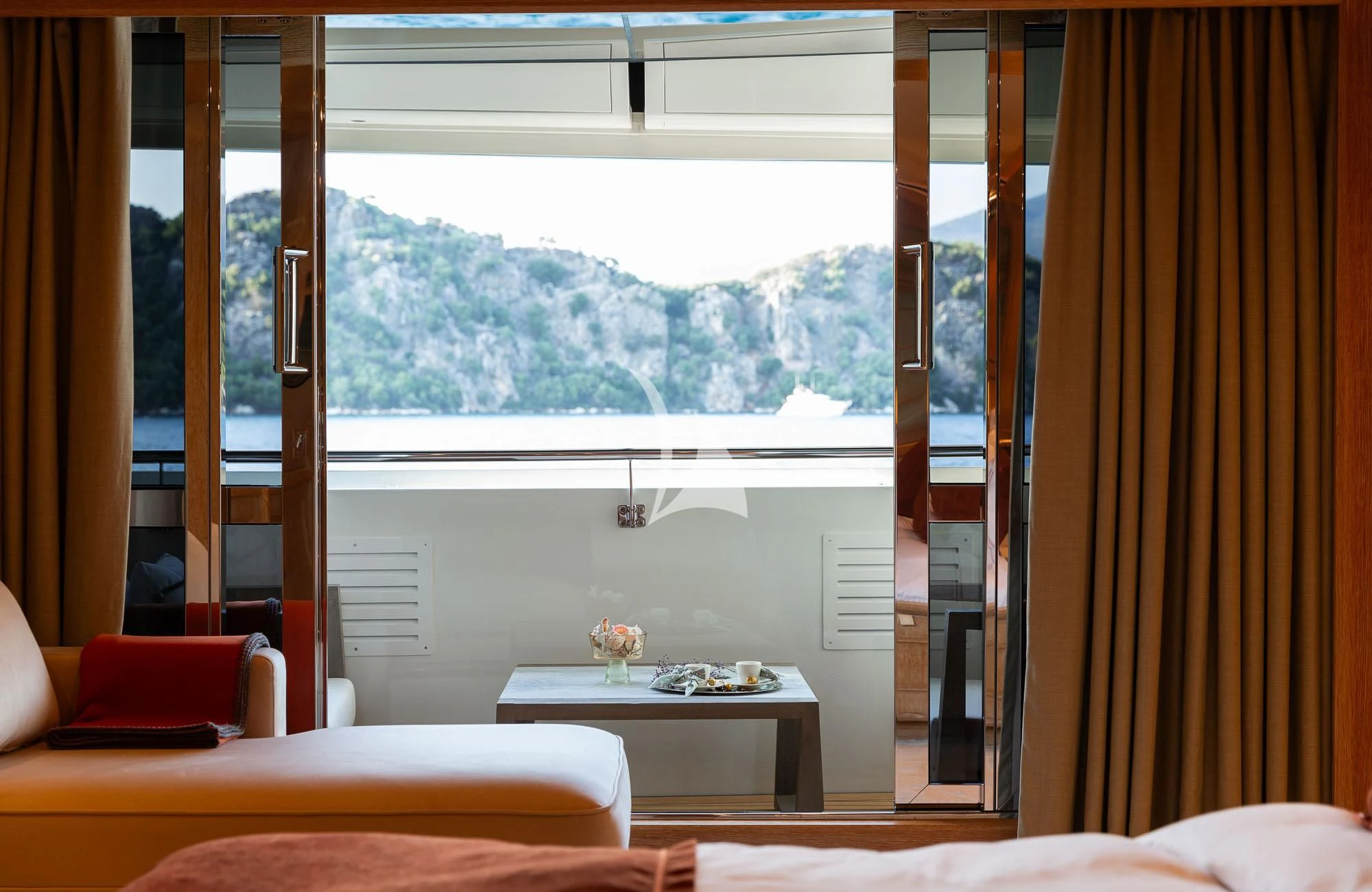 a room with a table and a window aboard LADY I Yacht for Charter