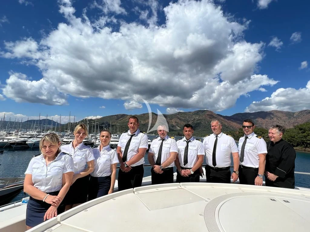 a group of people posing for a photo on a rooftop aboard LADY I Yacht for Charter