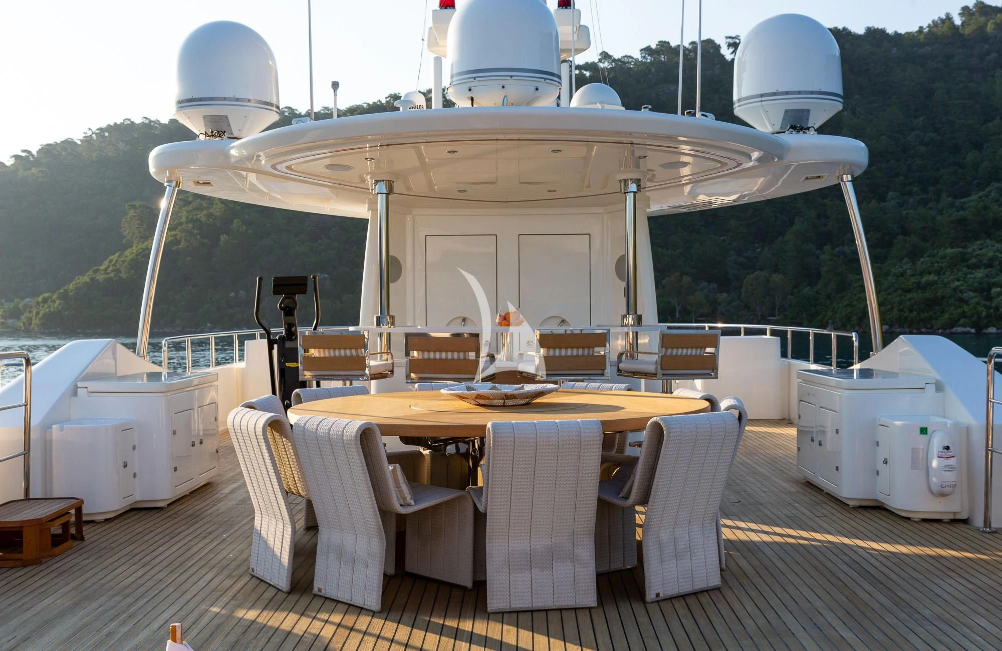 a table and chairs on a deck aboard LADY I Yacht for Charter