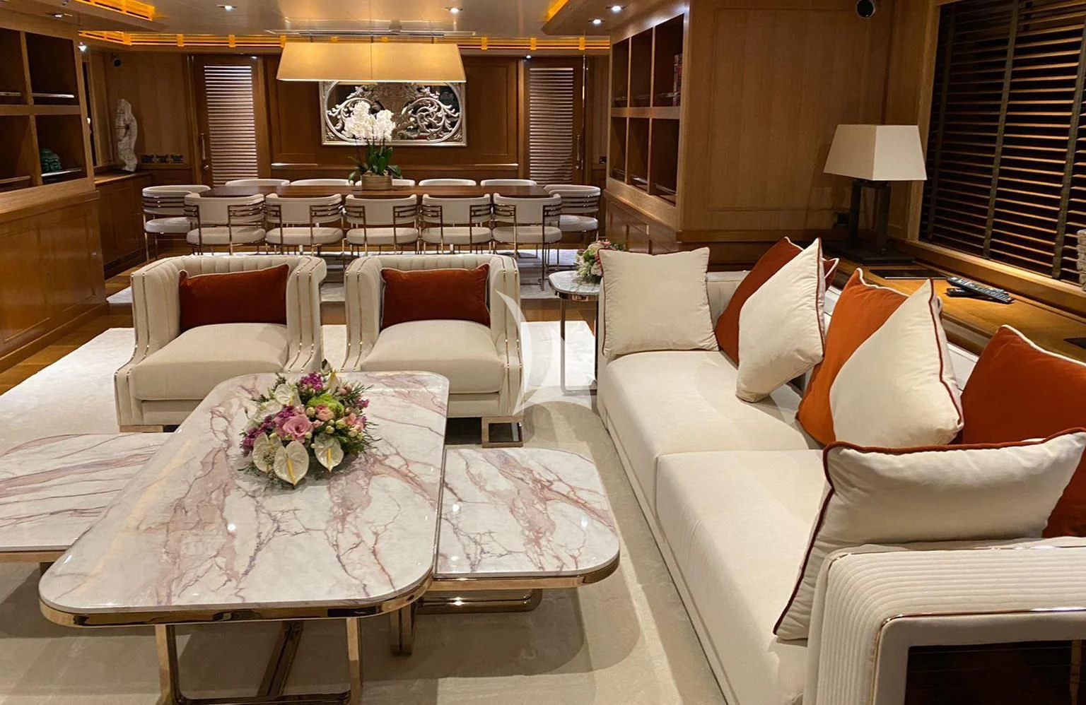 a large room with a table and chairs aboard LADY I Yacht for Charter