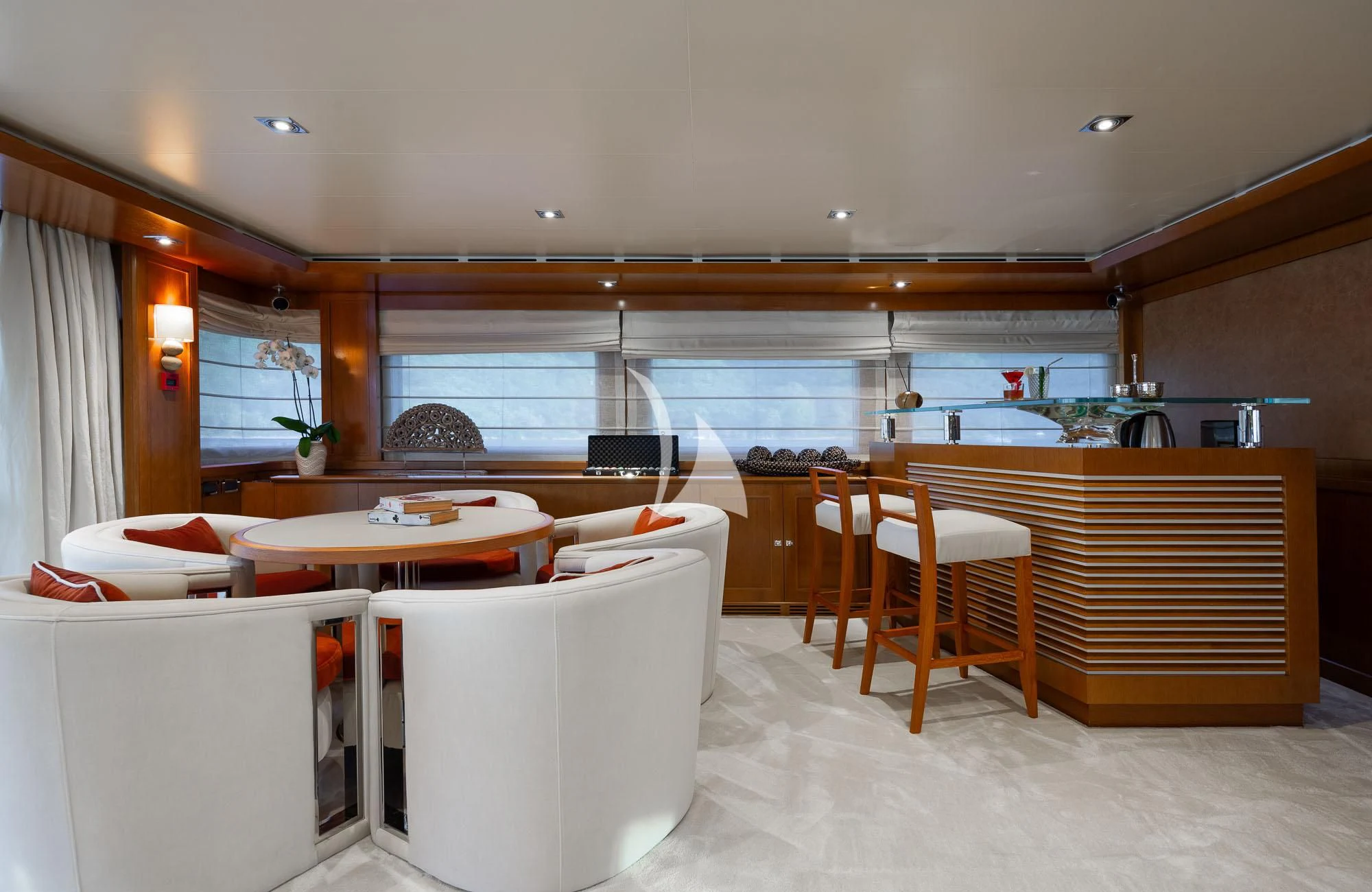 a room with tables and chairs aboard LADY I Yacht for Charter