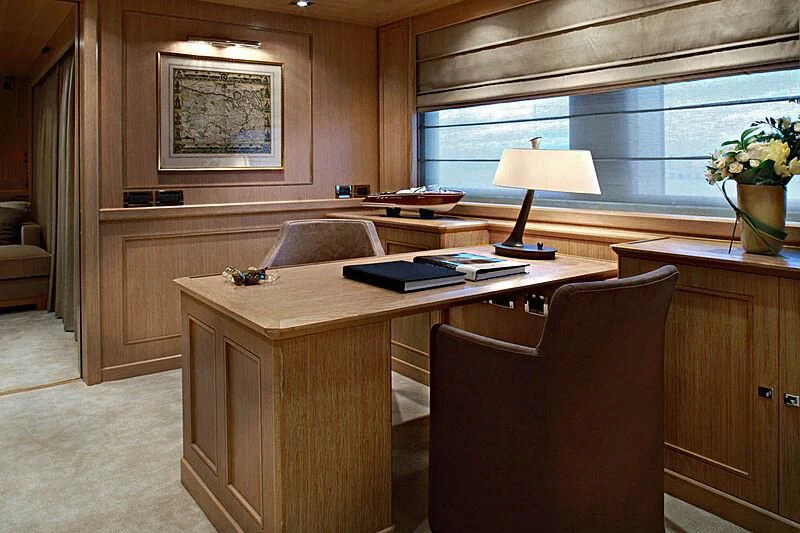 a room with a desk and a chair aboard LADY I Yacht for Charter