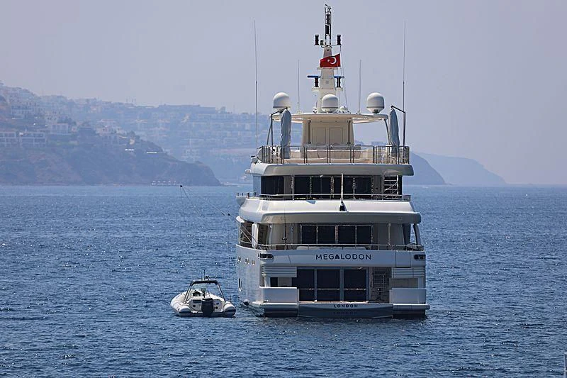 a boat and a small boat in the water aboard LADY I Yacht for Charter