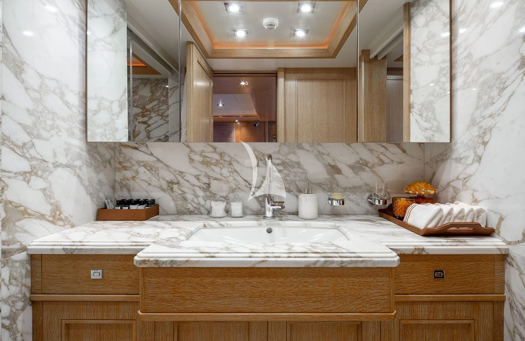 a bathroom with a sink and a mirror aboard LADY I Yacht for Charter