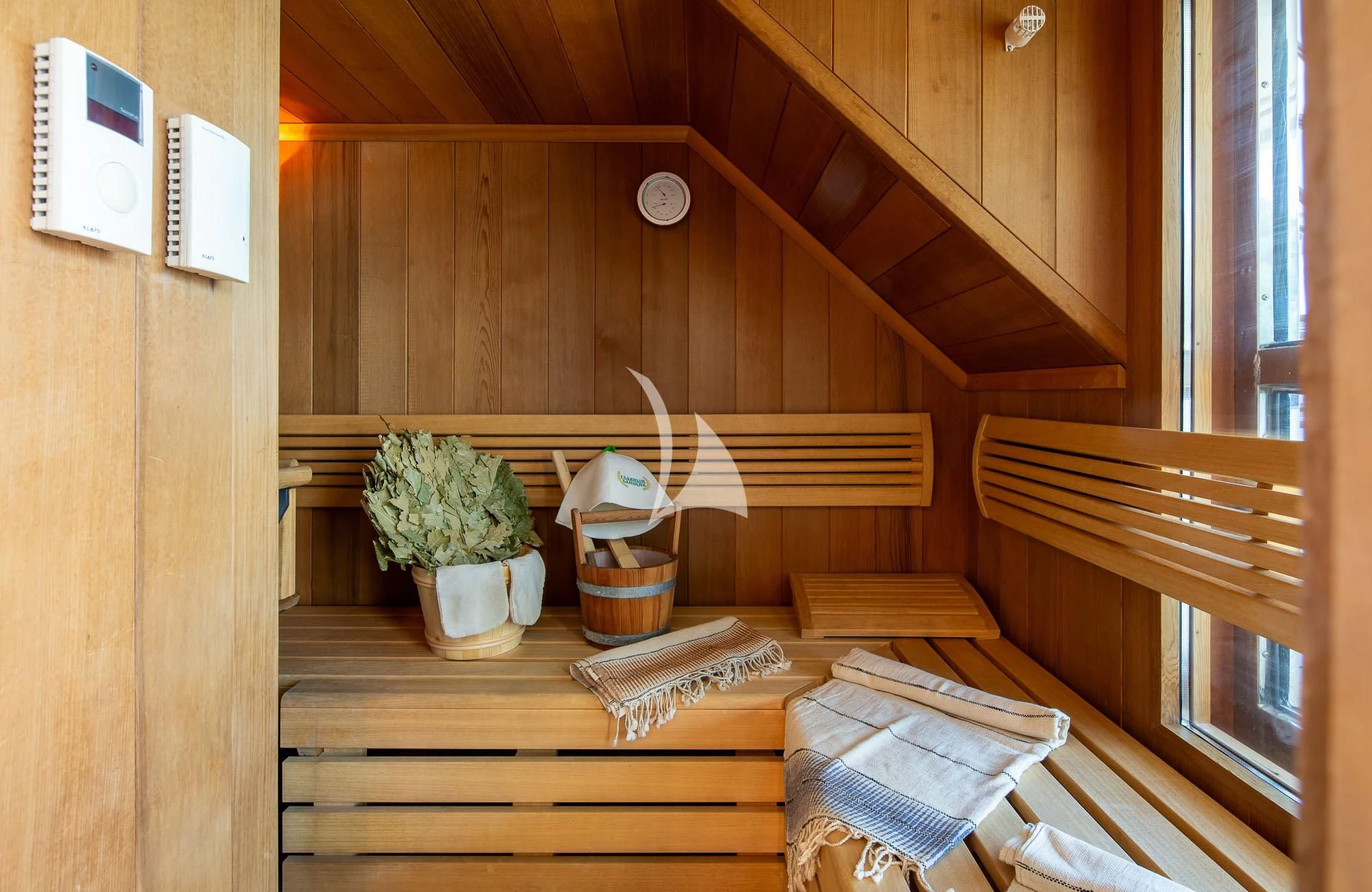 a wooden staircase with a plant in a pot on the side aboard LADY I Yacht for Charter