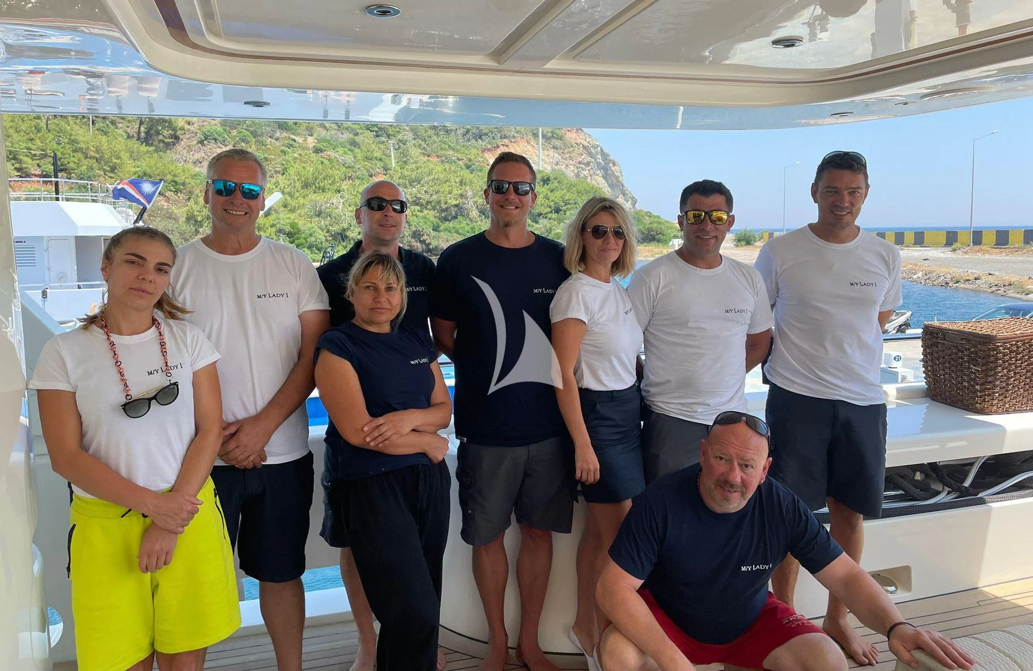 a group of people posing for a photo aboard LADY I Yacht for Charter