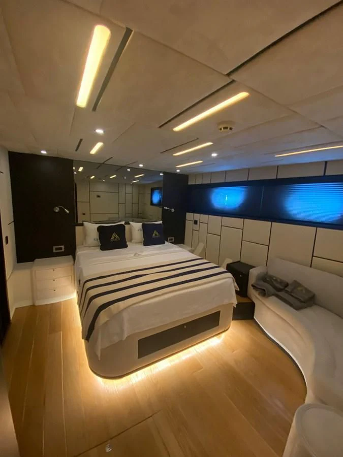 a room with a bed and a tv aboard AKSER Yacht for Sale