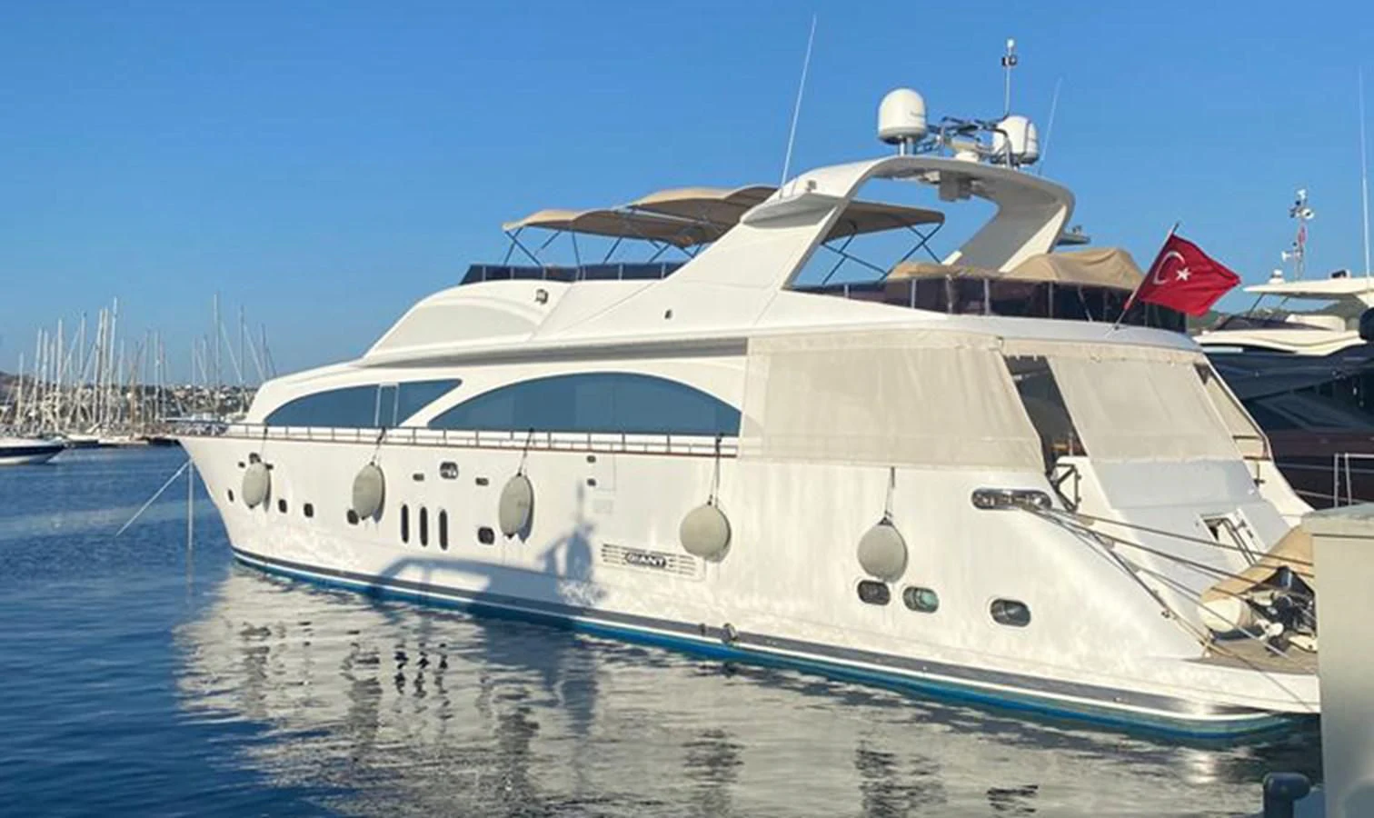 a white yacht in the water aboard AKSER Yacht for Sale