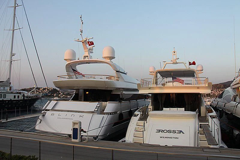 a couple of boats are parked at a dock aboard EROSSEA Yacht for Sale