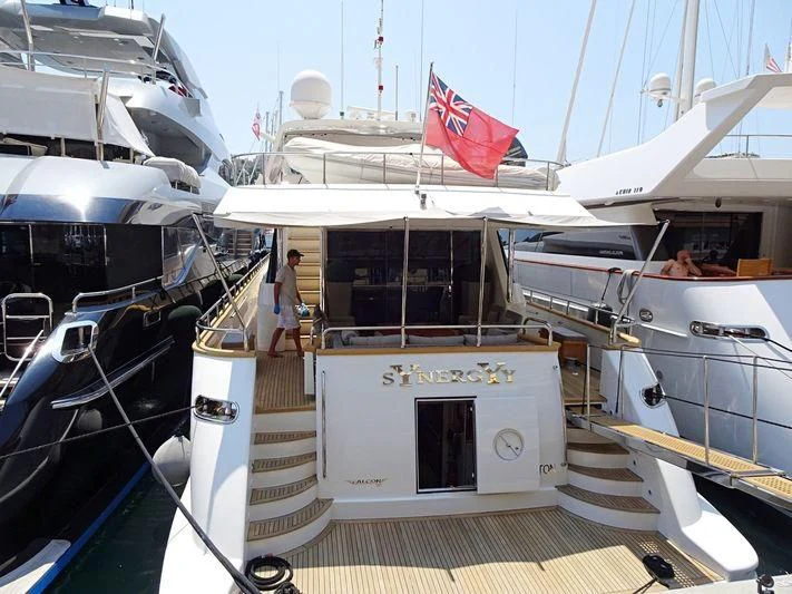 a boat with a flag on the front aboard SYNERGY Y Yacht for Sale