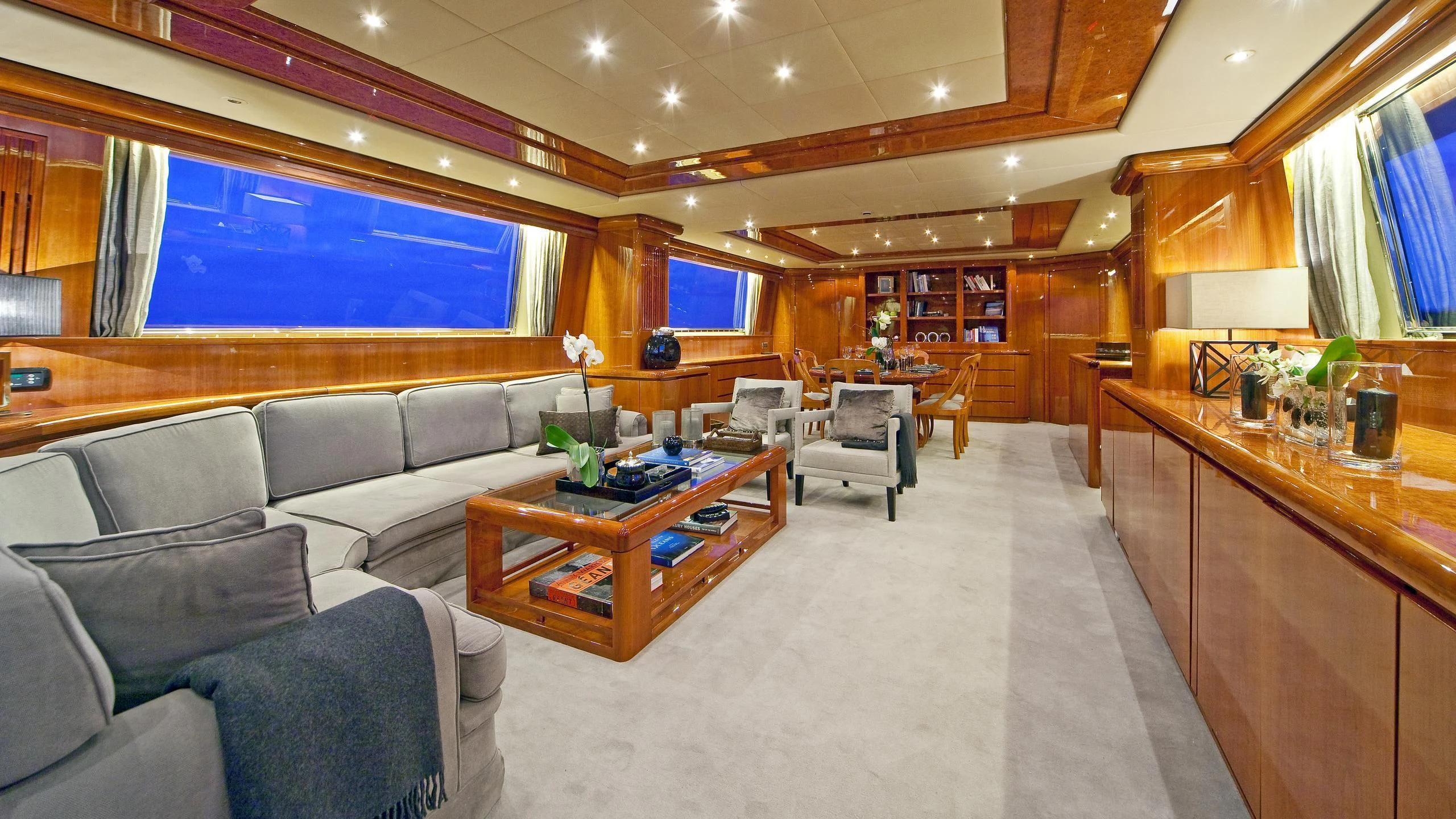 a living room with a couch and a coffee table aboard SYNERGY Y Yacht for Sale