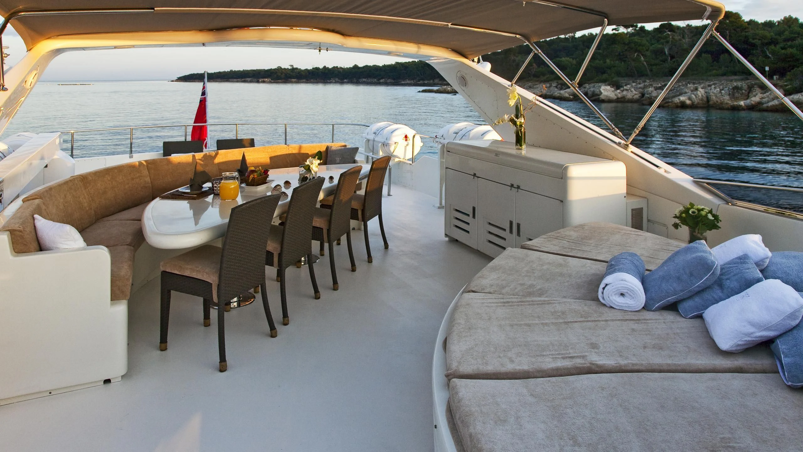 a table and chairs on a boat aboard SYNERGY Y Yacht for Sale