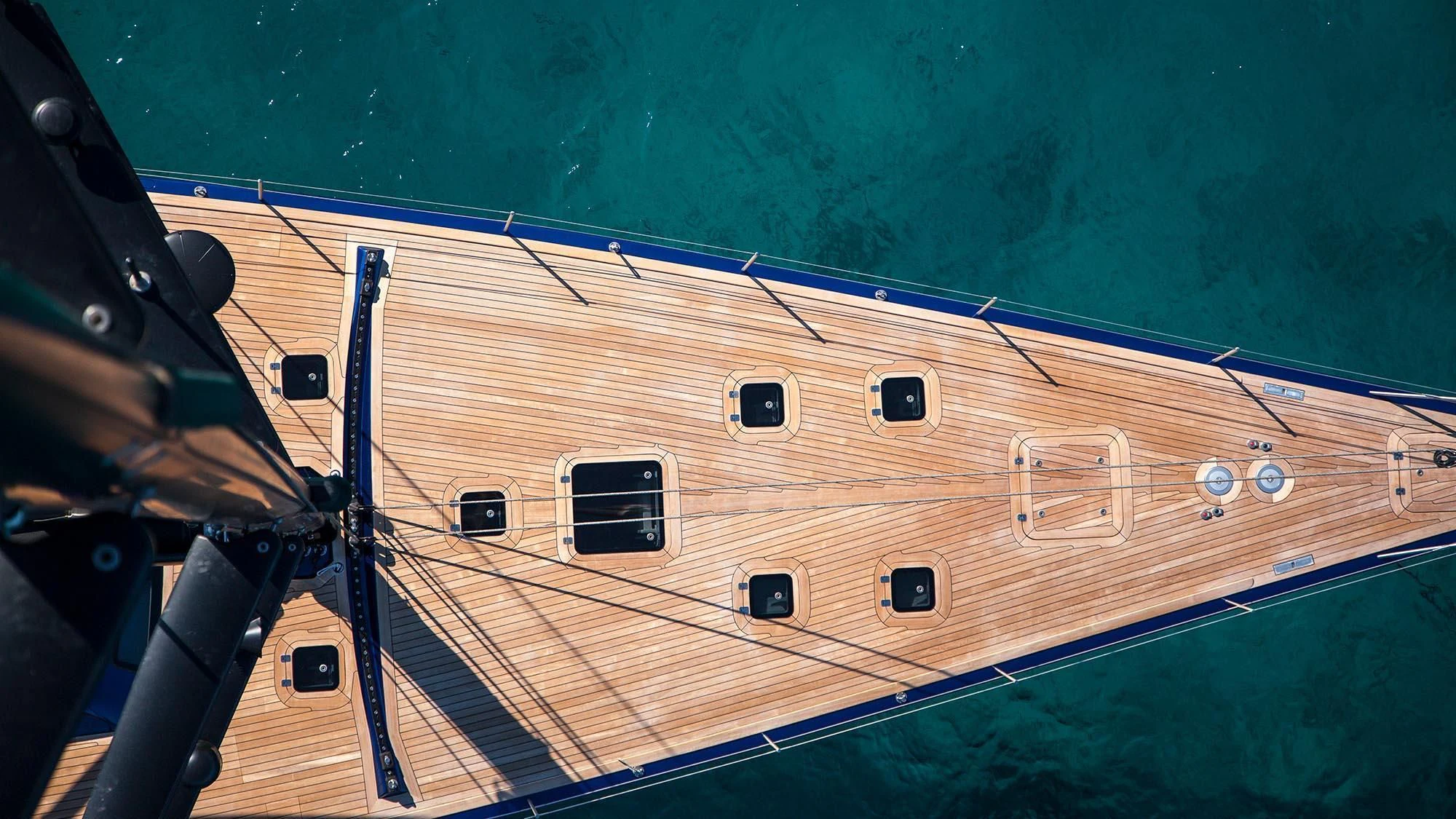 a wooden paneled upright piano aboard INTI CUBE Yacht for Sale