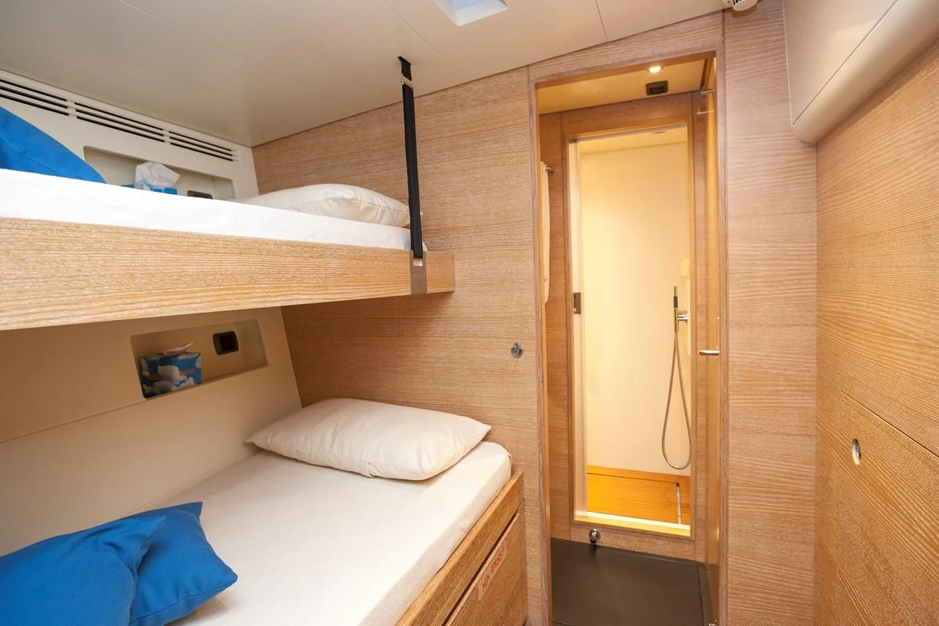 a room with a bed and a closet aboard INTI CUBE Yacht for Sale