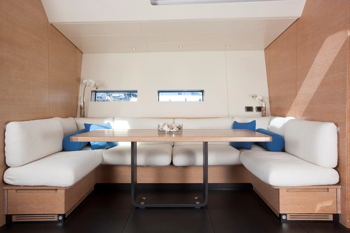 a room with a table and chairs aboard INTI CUBE Yacht for Sale