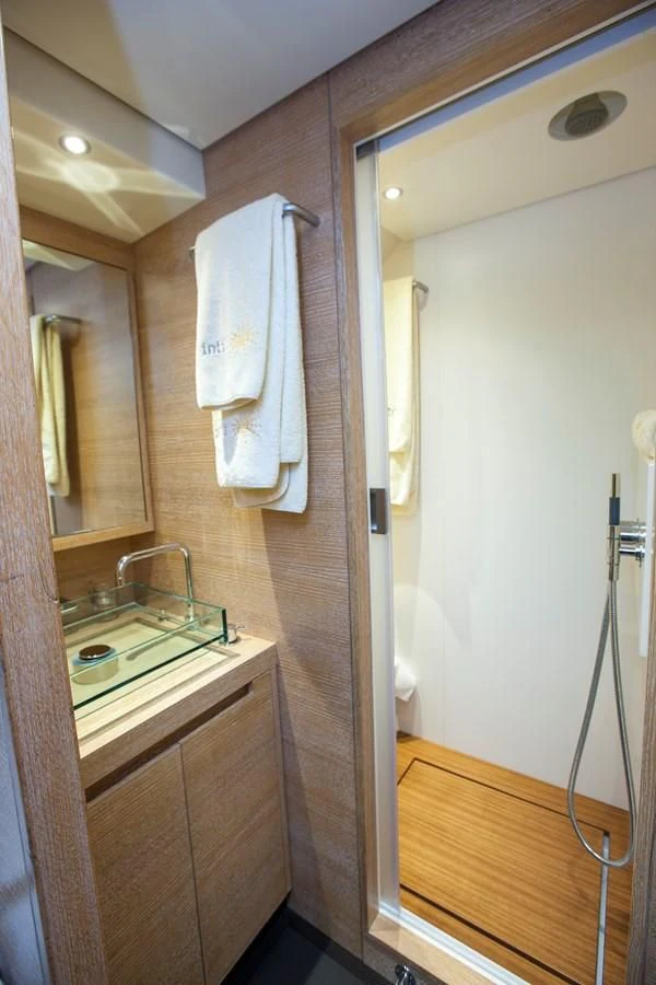 a bathroom with a sink and a mirror aboard INTI CUBE Yacht for Sale