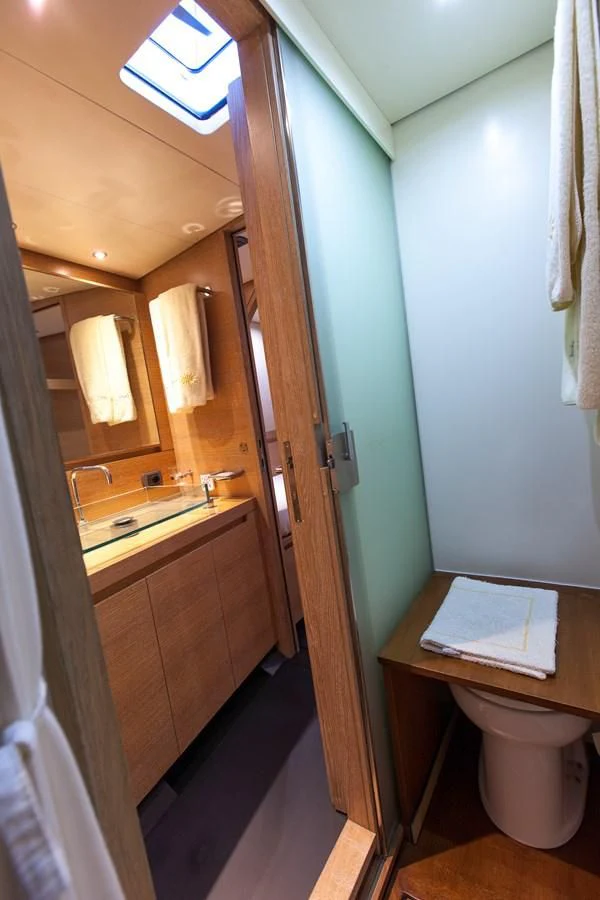 a bathroom with a toilet and a sink aboard INTI CUBE Yacht for Sale