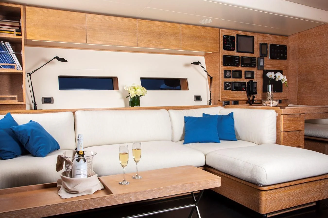 a living room with a white couch and a coffee table aboard INTI CUBE Yacht for Sale