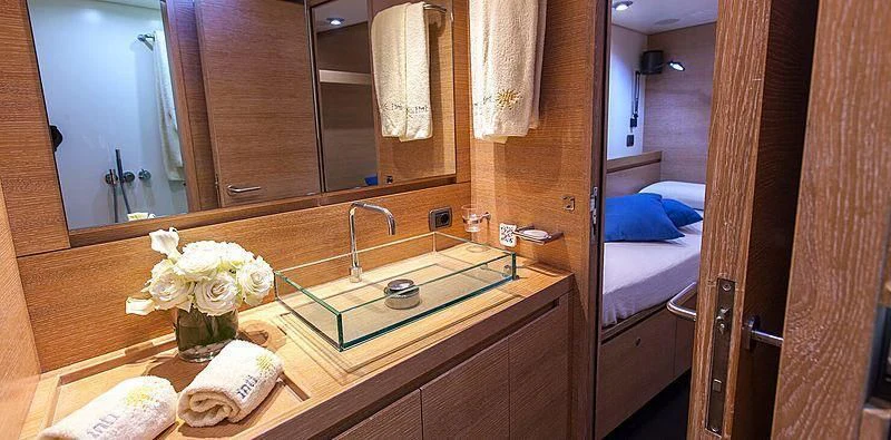 a bathroom with a large mirror aboard INTI CUBE Yacht for Sale