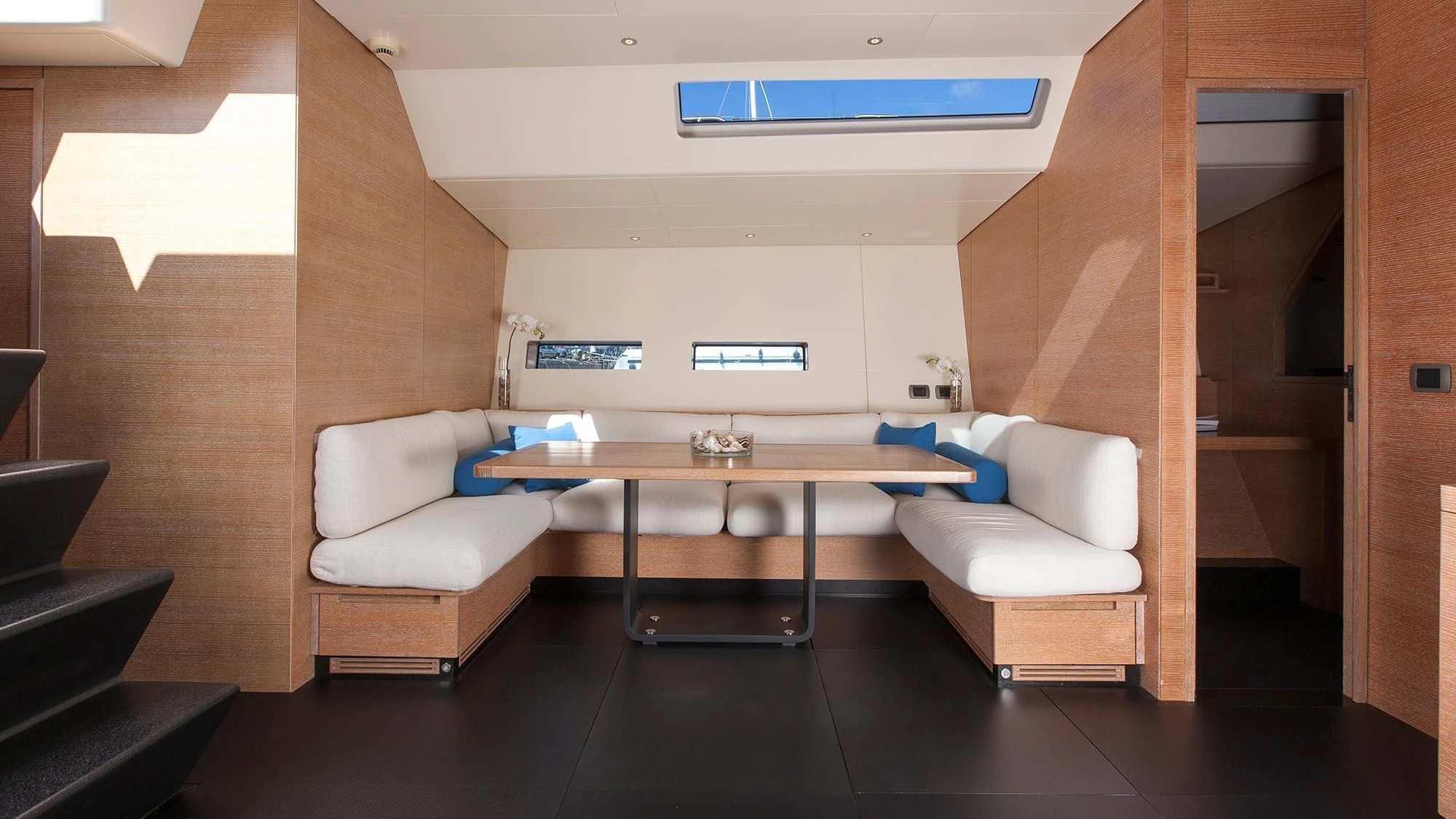 a room with a table and chairs aboard INTI CUBE Yacht for Sale