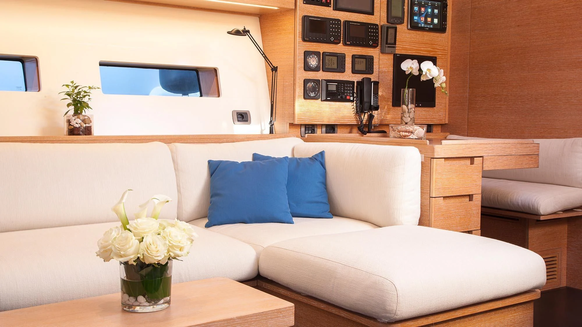 a vase of flowers sits on a table aboard INTI CUBE Yacht for Sale