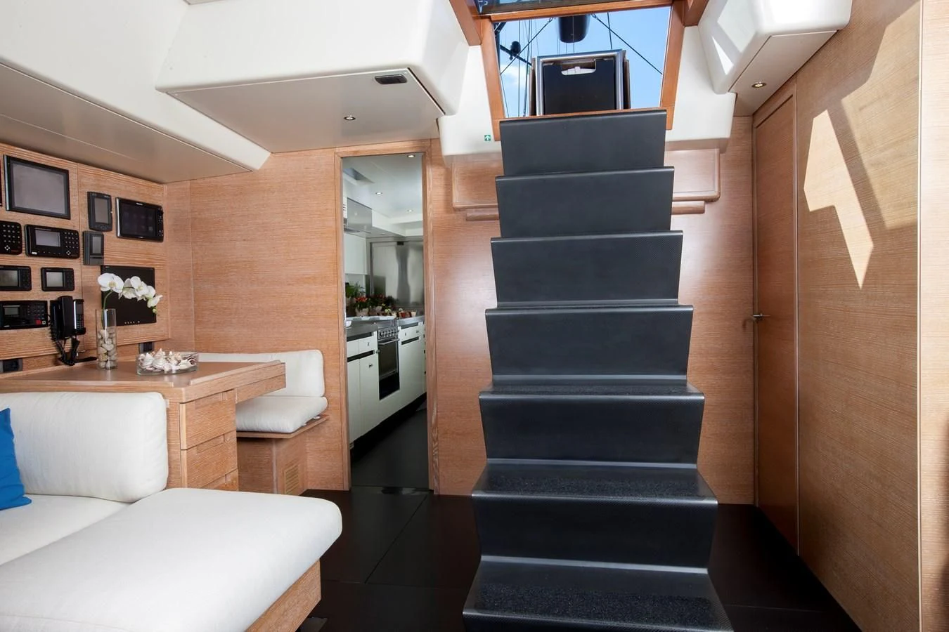 a room with a bed and a desk aboard INTI CUBE Yacht for Sale