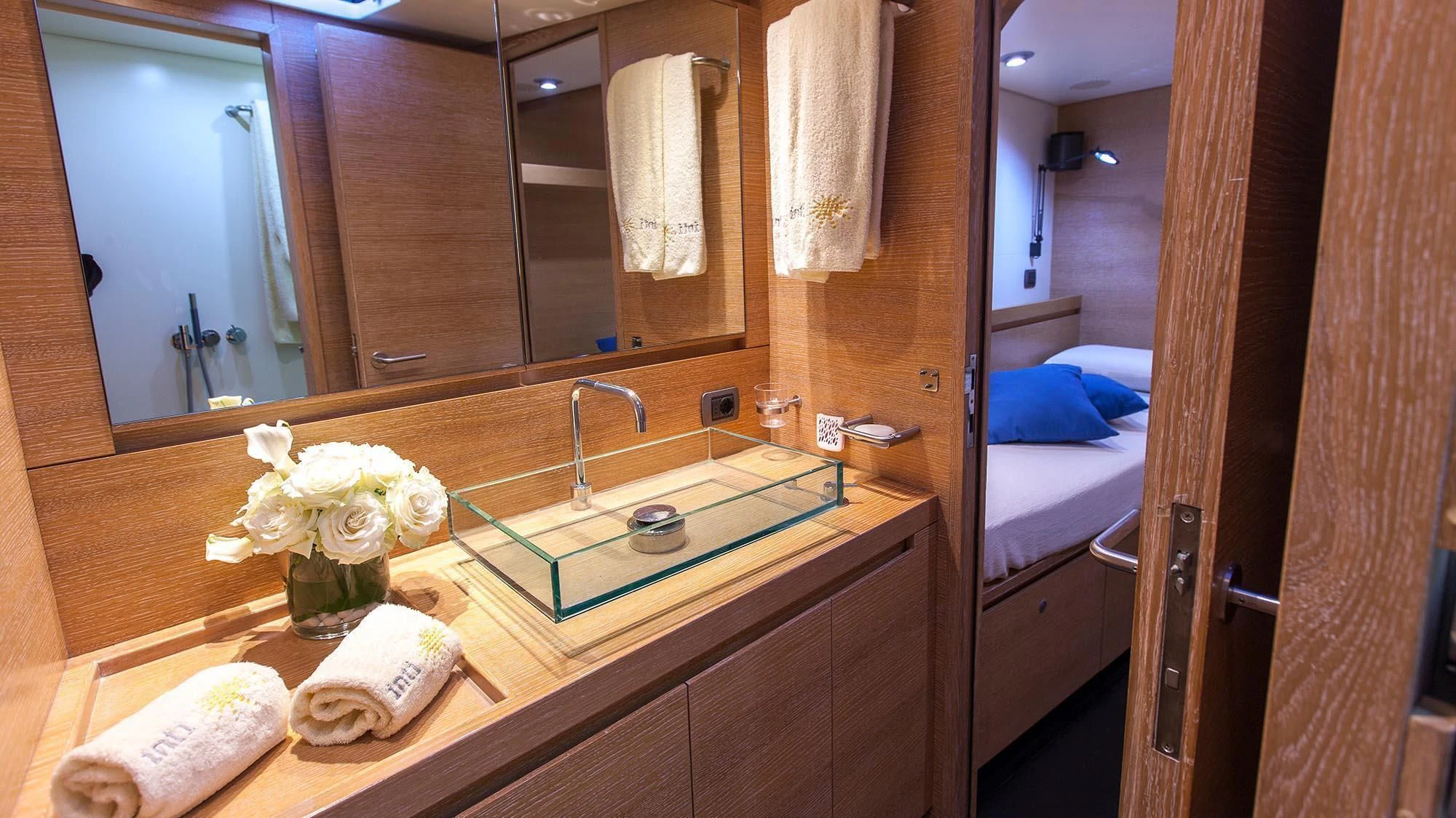 a bathroom with a large mirror aboard INTI CUBE Yacht for Sale