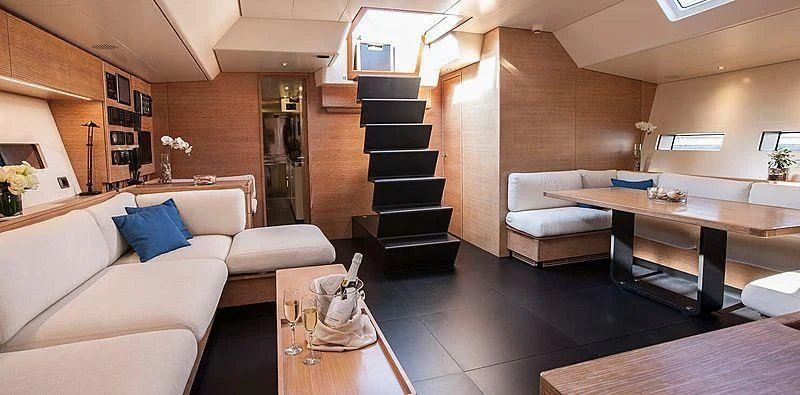 a living room with a staircase aboard INTI CUBE Yacht for Sale