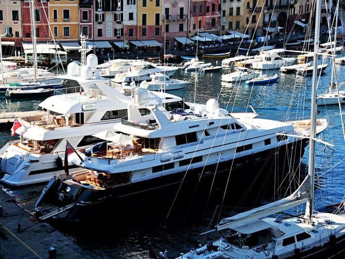 a group of boats are parked in a harbor aboard ASTRA ULTIMA Yacht for Sale