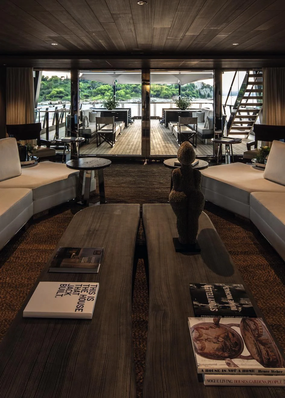 a room with a wood table and a couch and a large window aboard ATLANTE Yacht for Sale