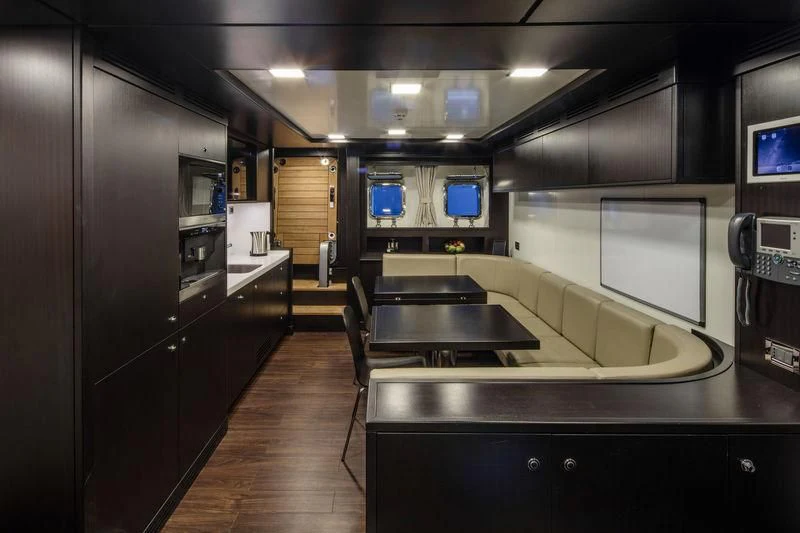 a kitchen with a large island aboard ATLANTE Yacht for Sale