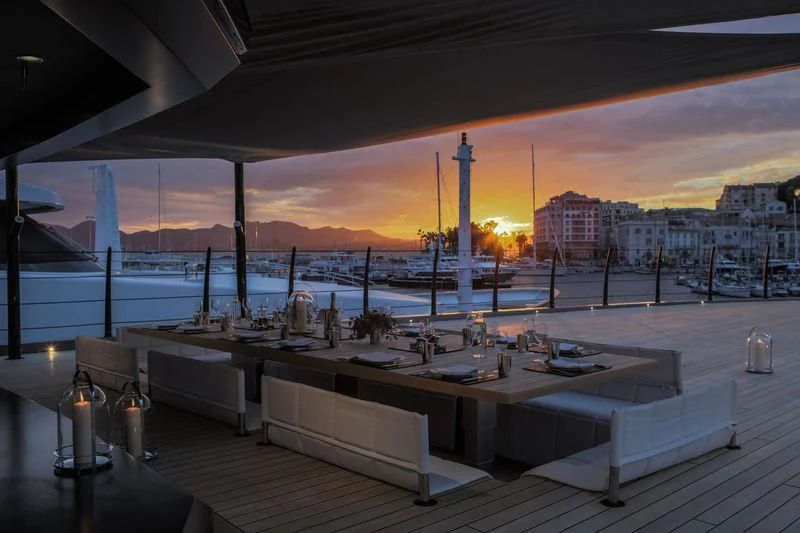 a table with candles on it aboard ATLANTE Yacht for Sale