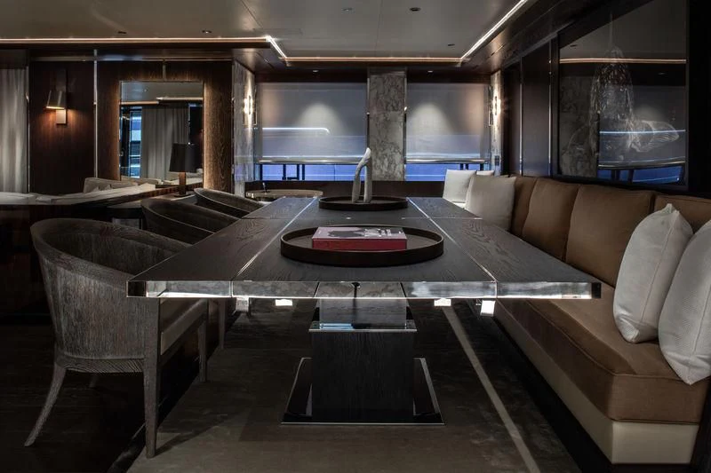 a large room with a table and chairs aboard ATLANTE Yacht for Sale
