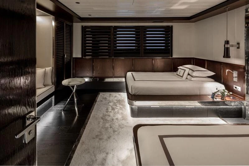 a room with a bed and a desk aboard ATLANTE Yacht for Sale