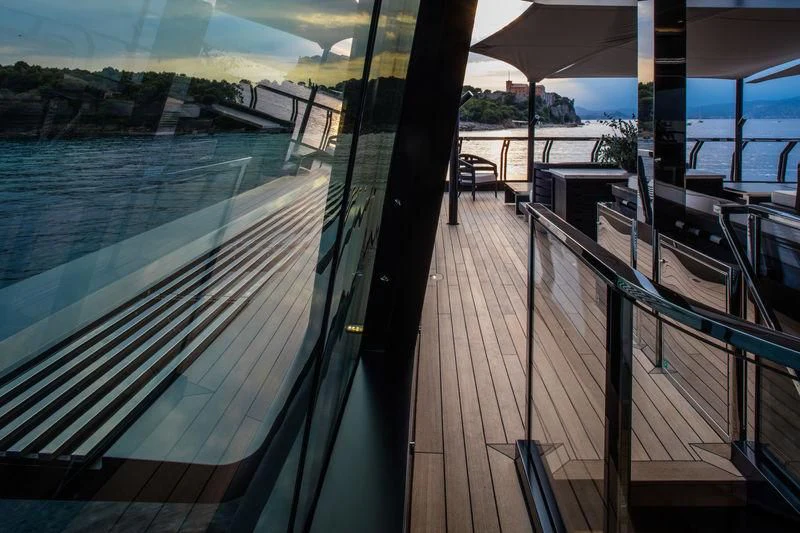 a deck with a deck and chairs aboard ATLANTE Yacht for Sale