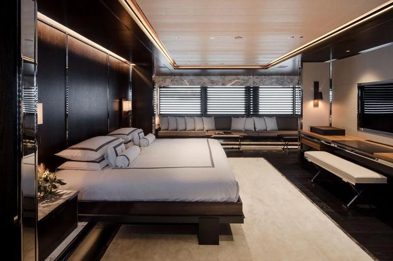 a room with a bed and desk aboard ATLANTE Yacht for Sale