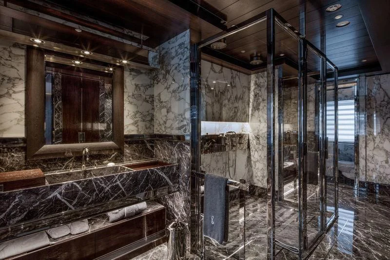 a room with a large fireplace aboard ATLANTE Yacht for Sale