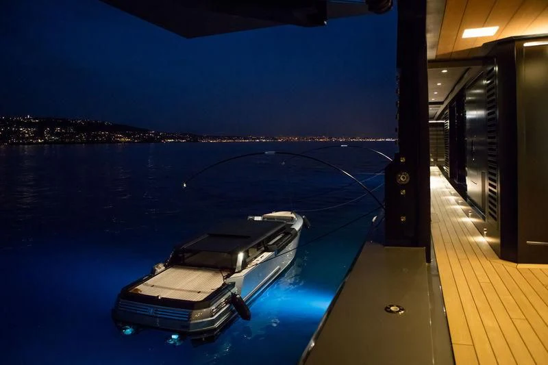 a deck with a pool and a deck with a view of a city aboard ATLANTE Yacht for Sale