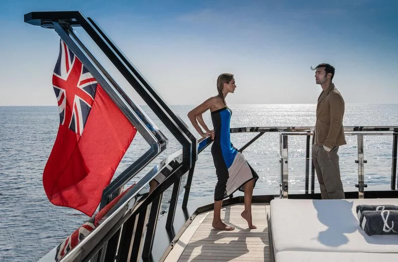 a man and a woman on a boat with a flag aboard ATLANTE Yacht for Sale