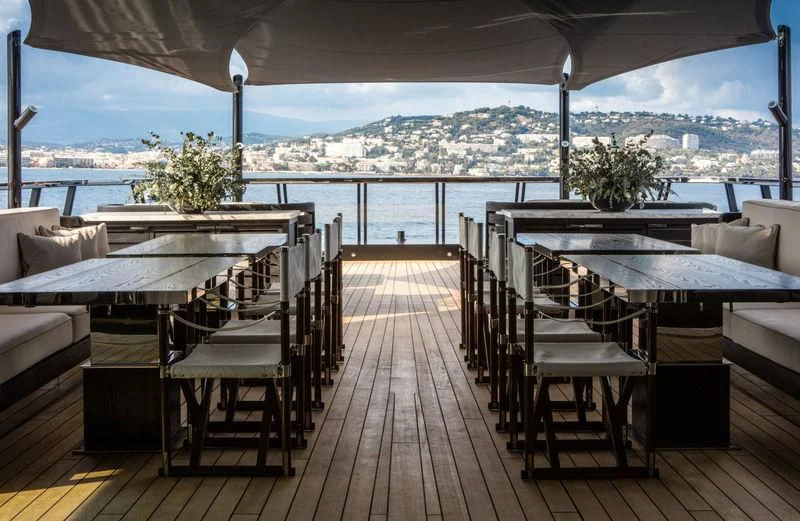 a deck with chairs and tables on it aboard ATLANTE Yacht for Sale