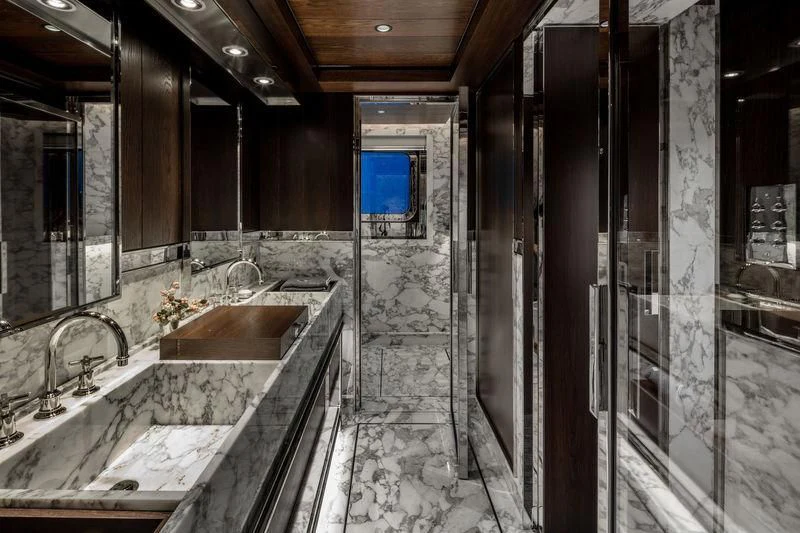 a bathroom with marble tiles aboard ATLANTE Yacht for Sale