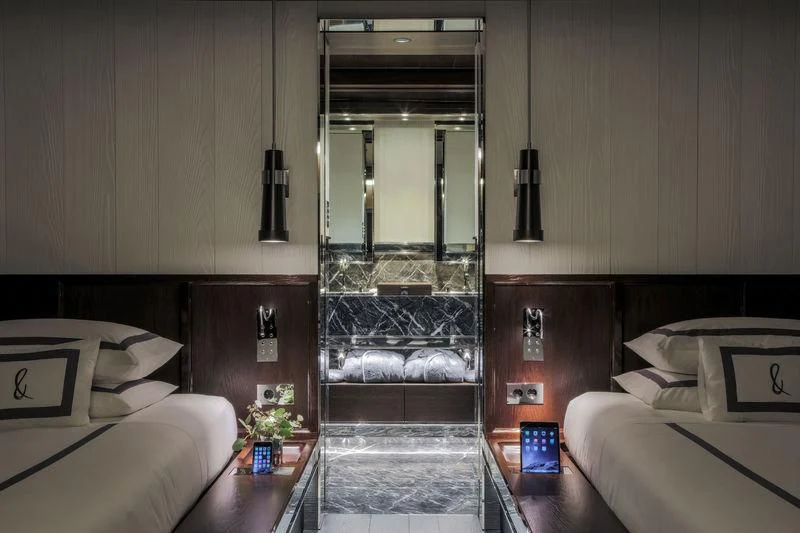 a room with a bed and a door aboard ATLANTE Yacht for Sale